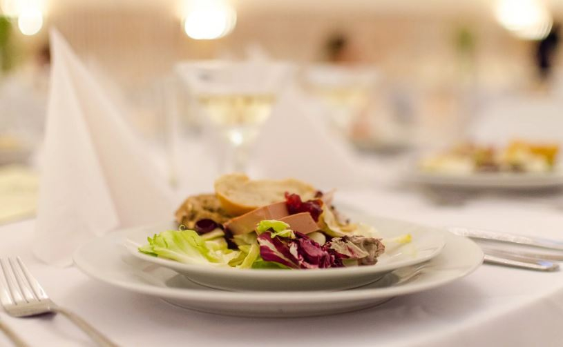 Fine dining dish with a wine glass